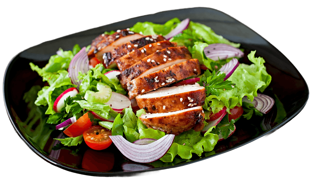 Grilled chicken avocado salad on a black plate